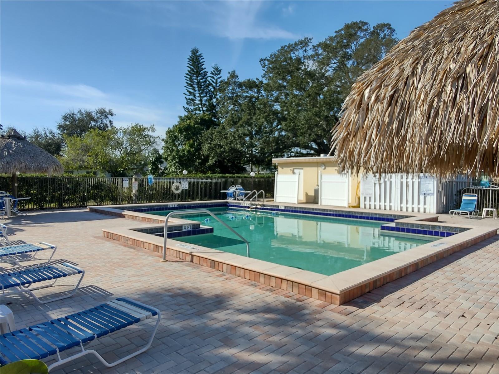 Lounge chairs to relax by the pool and changing area.