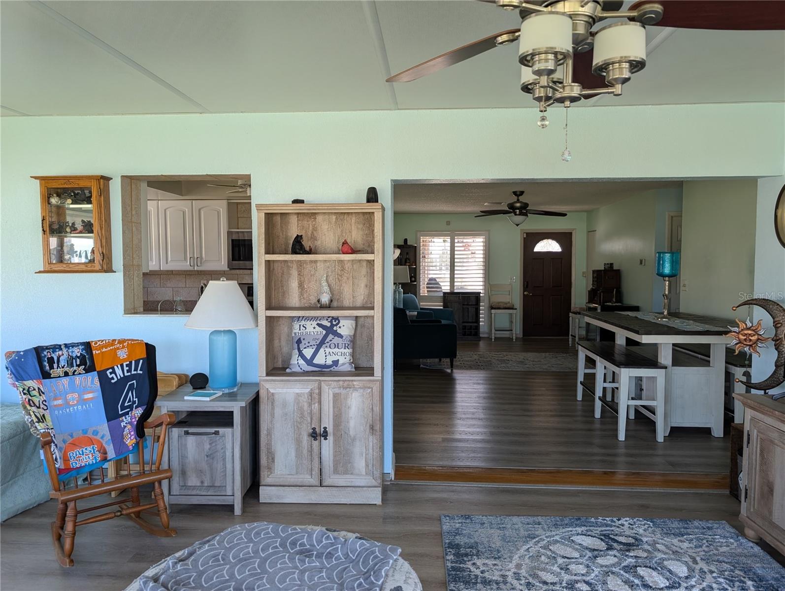 View from Florida room thru dining room to front entry and the pass thru window into kitchen.