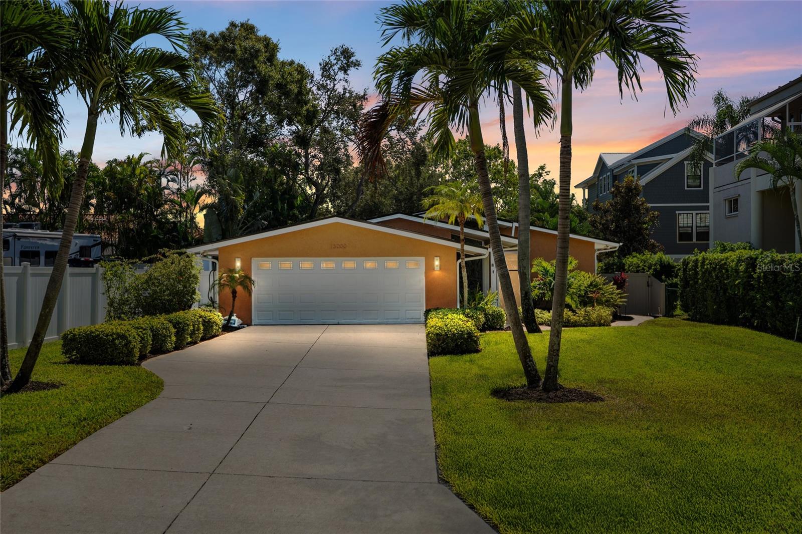 LONG DRIVEWAY, 2 CAR GARAGE AND NICE LIGHTING AND LANDSCAPING.