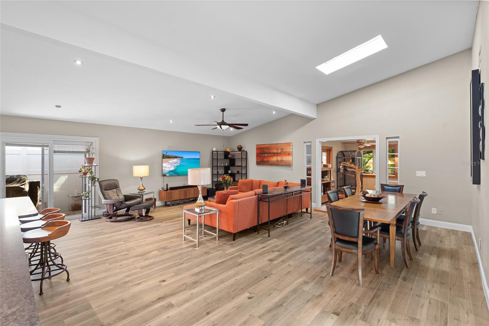 SLIDING GLASS DOOR TAKES YOU OUT TO THE COURTYARD. SKYLIGHTS OVER DINING AREA, BRING IN NATURAL LIGHTING.