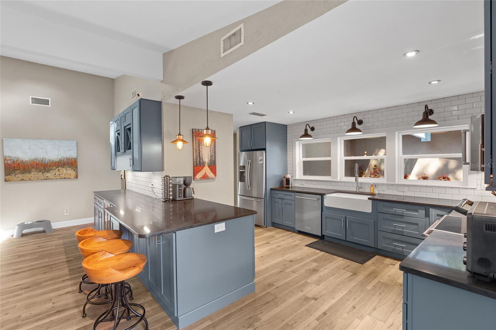 BEAUTIFUL SCONCES OVER SINK AREA AND A COZY SCREENED IN COURTYARD JUST OUTSIDE THE WINDOWS
