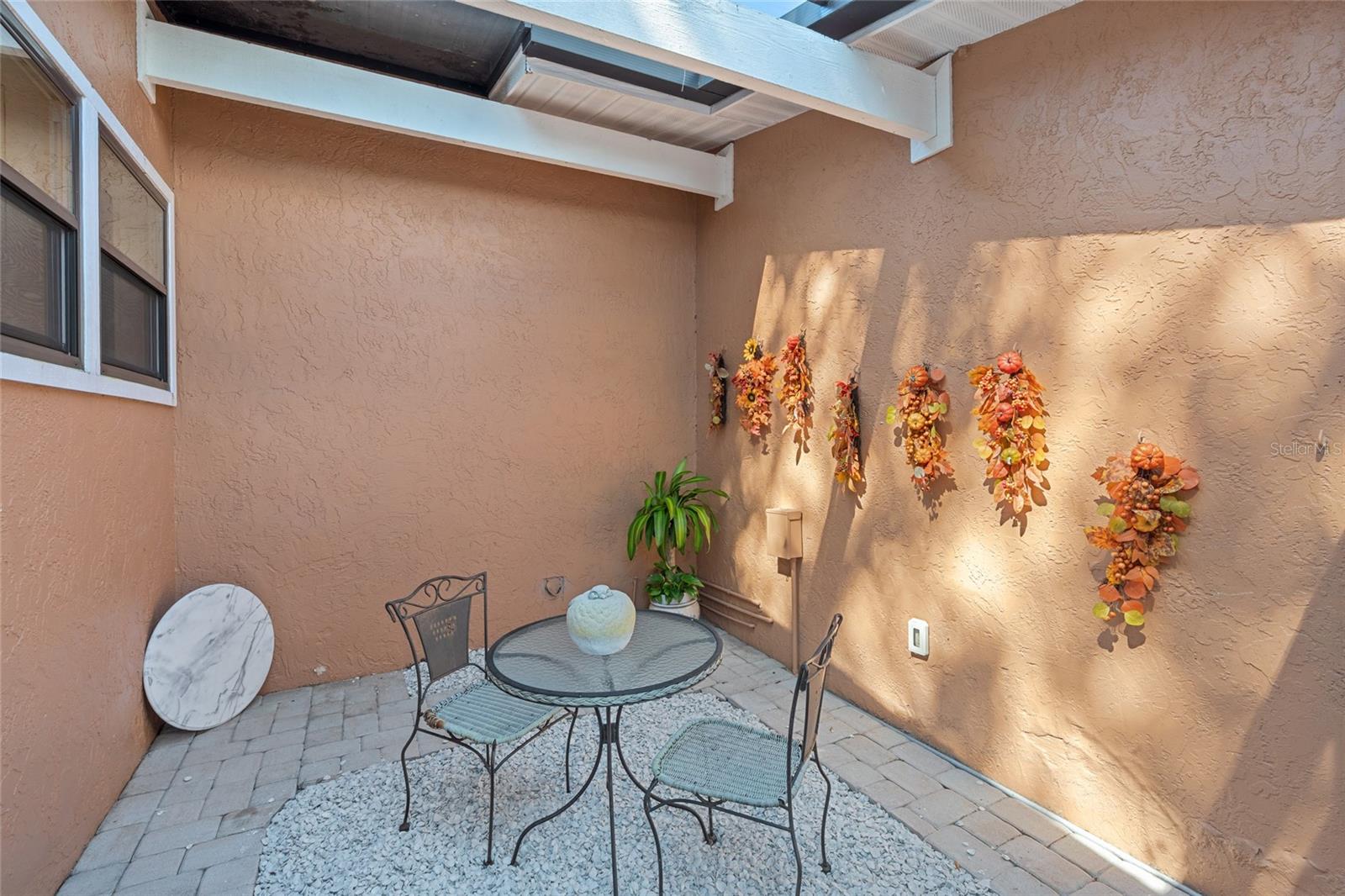 COZY SCREENED IN COURTYARD