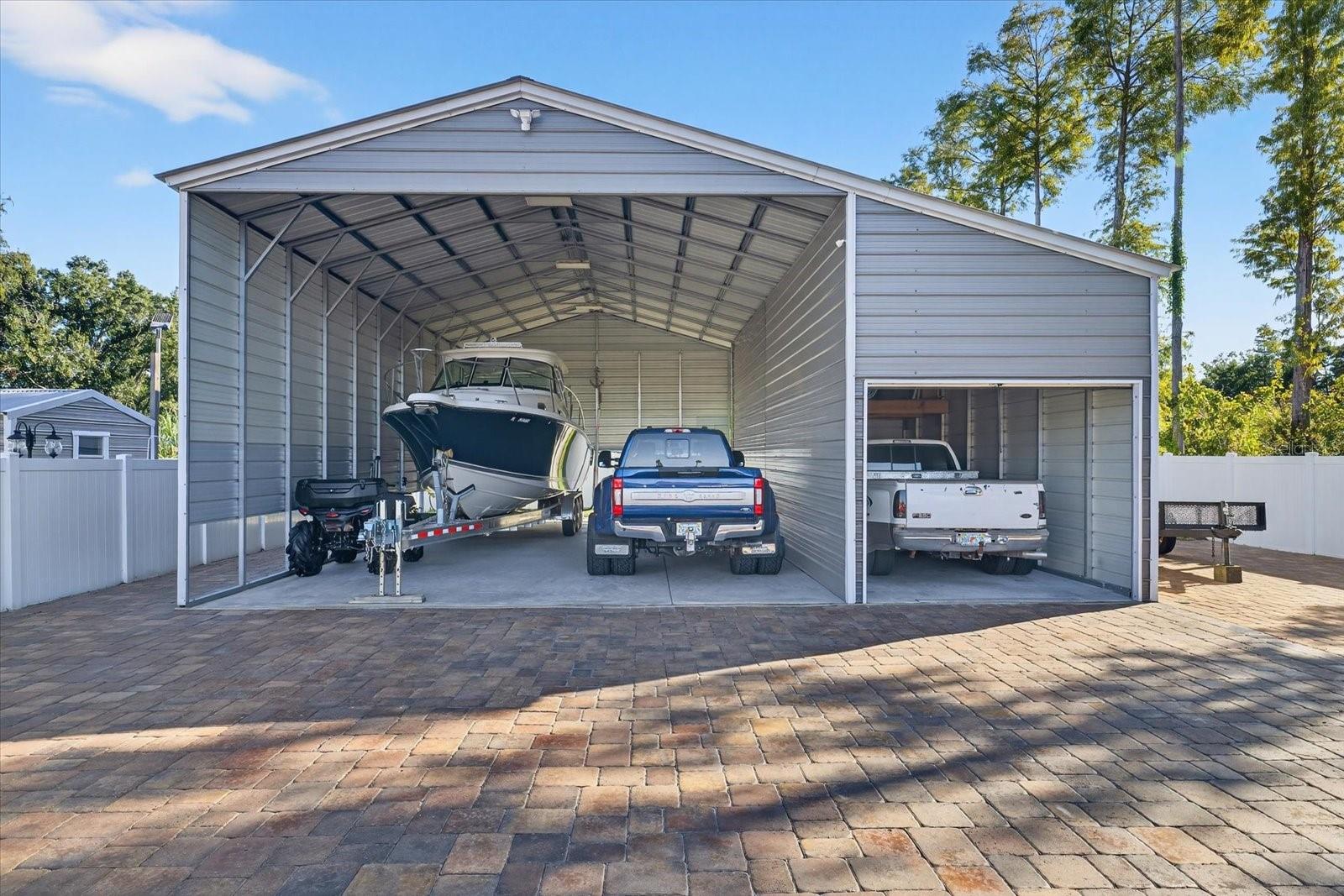 PAVED BACKYARD/CARPORT
