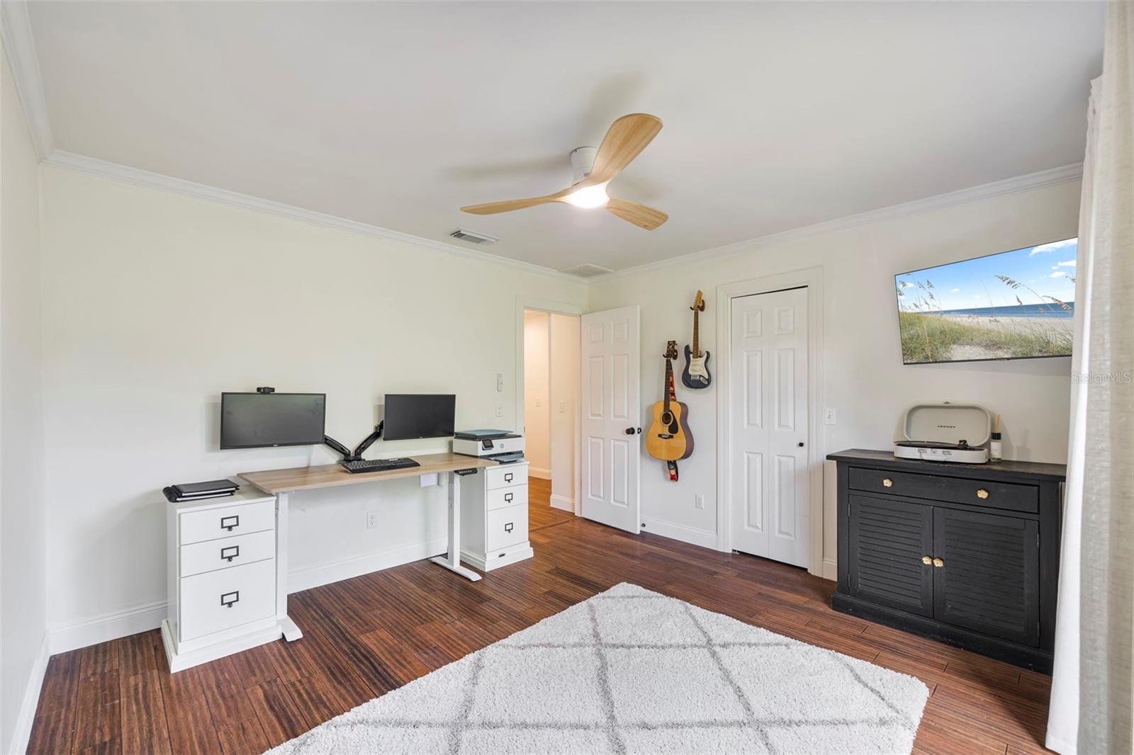 Bedroom 2 with walk in closet is currently used as home office.