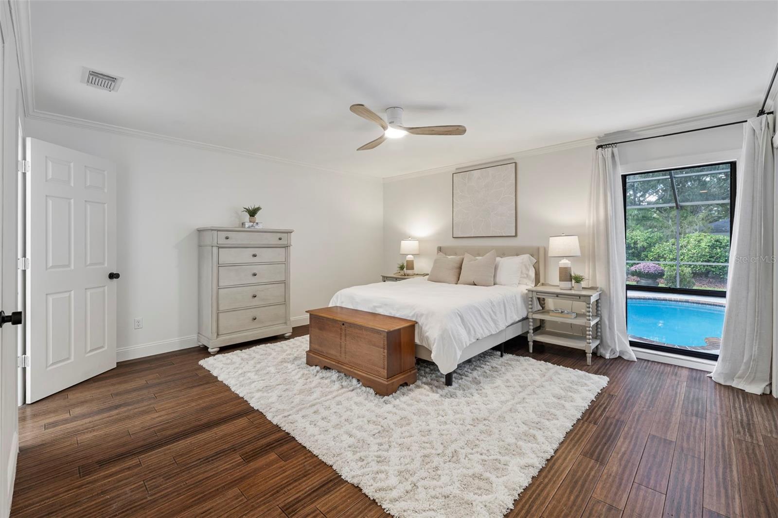 Primary Suite with sliders to pool deck.