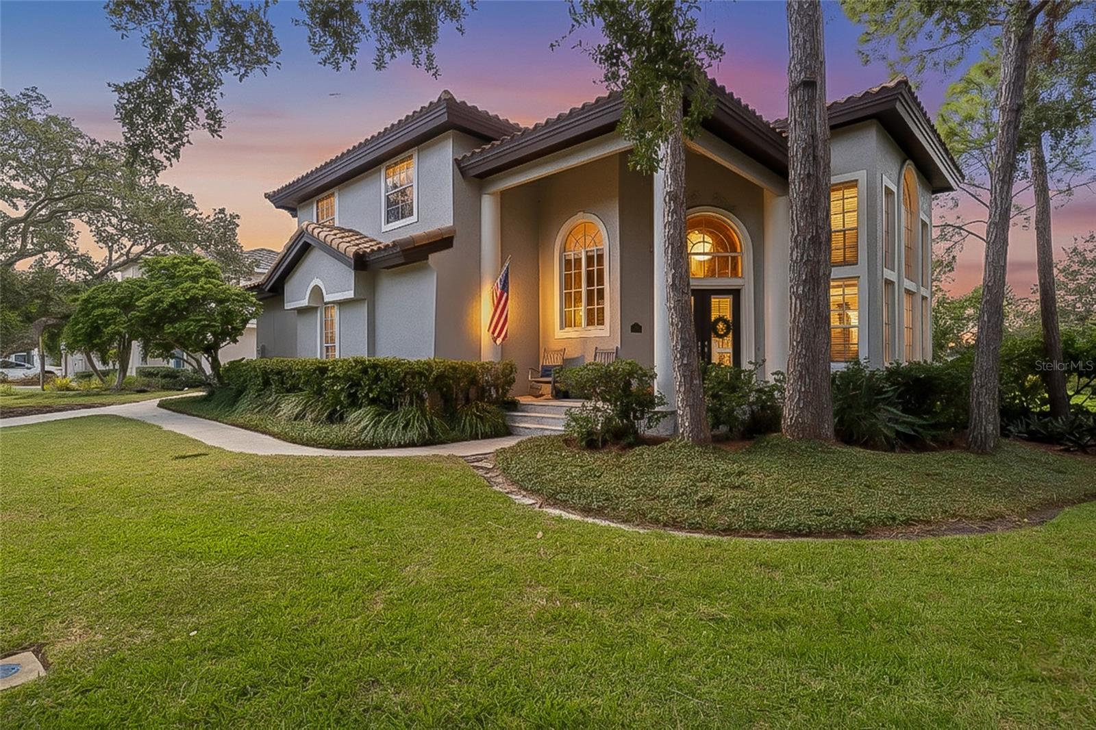 A Southern-style front porch greets you as you approach this stunning executive home in Placido Bayou.