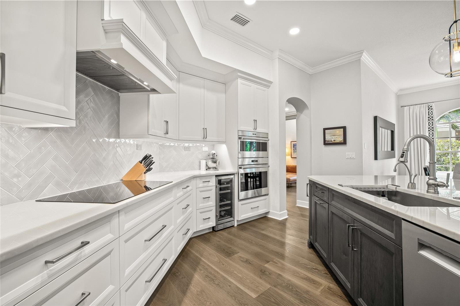 This kitchen is truly out of a magazine! Range hood, custom cabinets and discreet pull out cabinets keep it sleek and clean.
