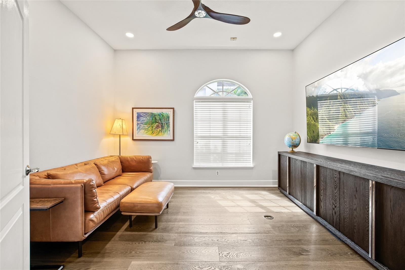 The first floor has a designated office space currently used as a second TV room.