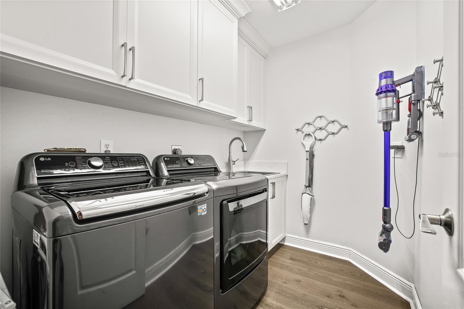 Interior laundry room with storage located on the first floor.