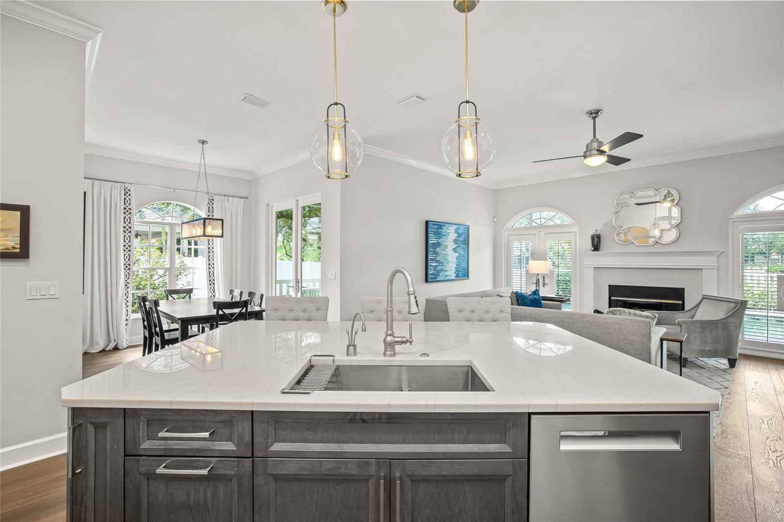 Quartzite countertops on this oversized kitchen island perfect for gathering around appetizers and drinks.