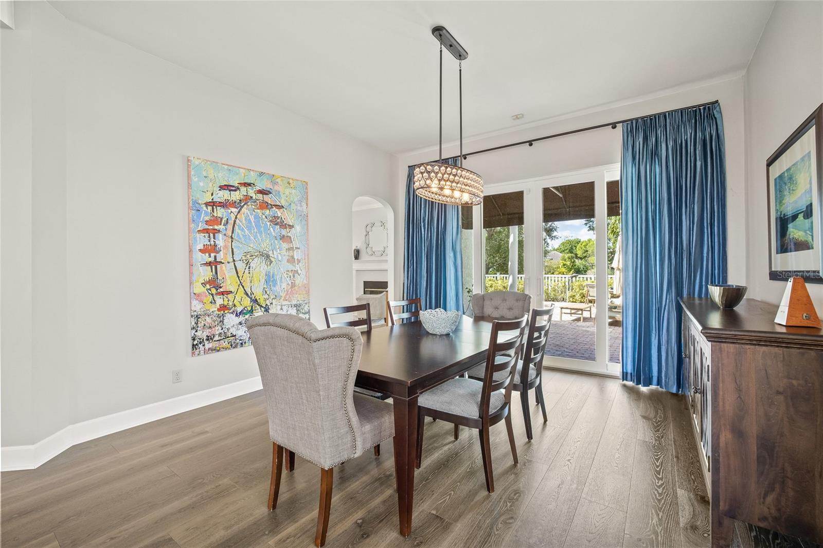 The formal dining room features new, impact sliding doors overlooking the pool.