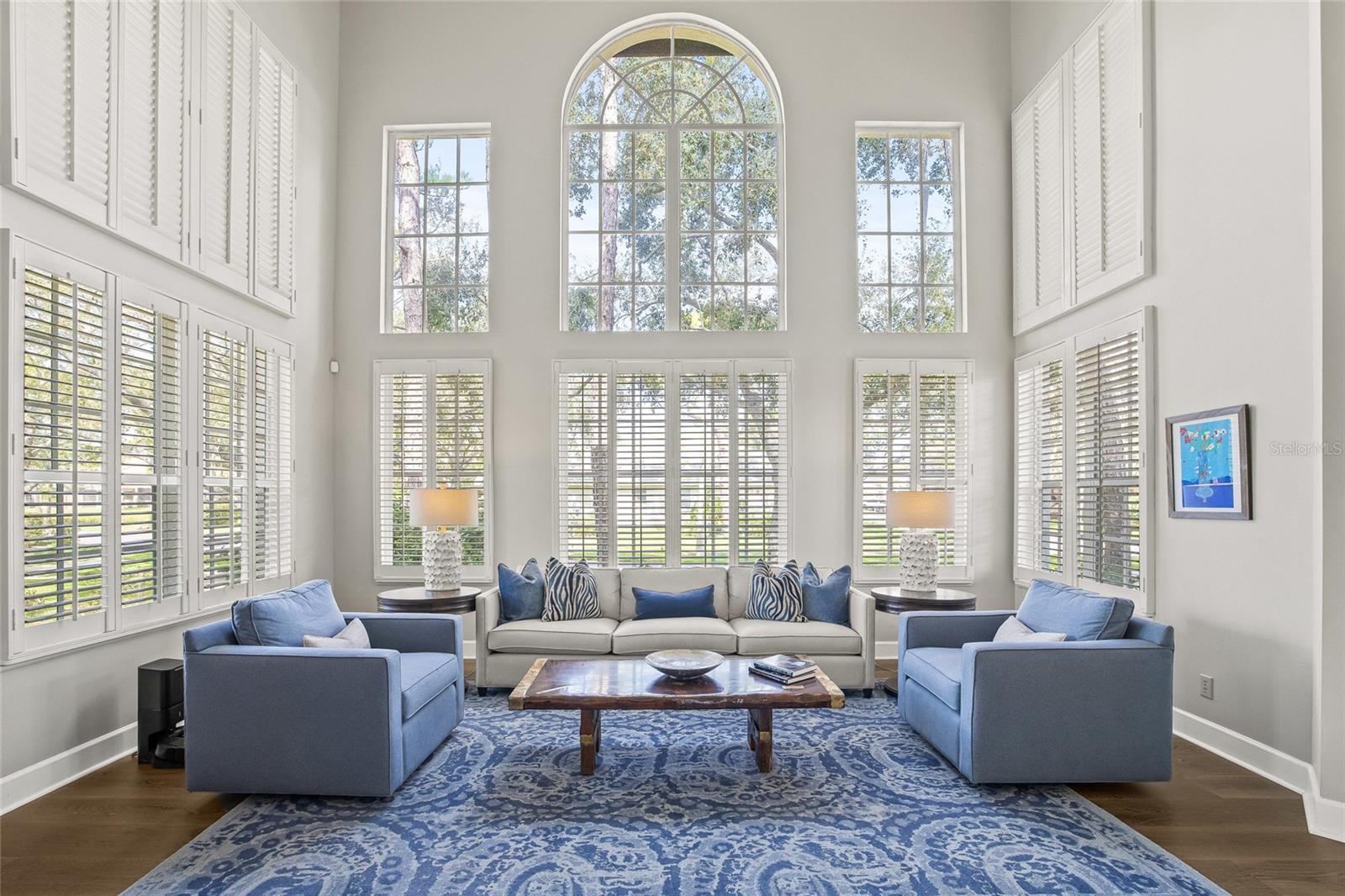 Grand front room with lots of natural light and soaring ceilings. ceilings.