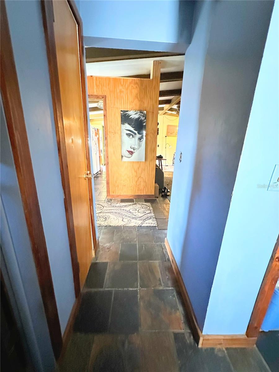 Hallway leading from guest bedrooms to living area/kitchen.