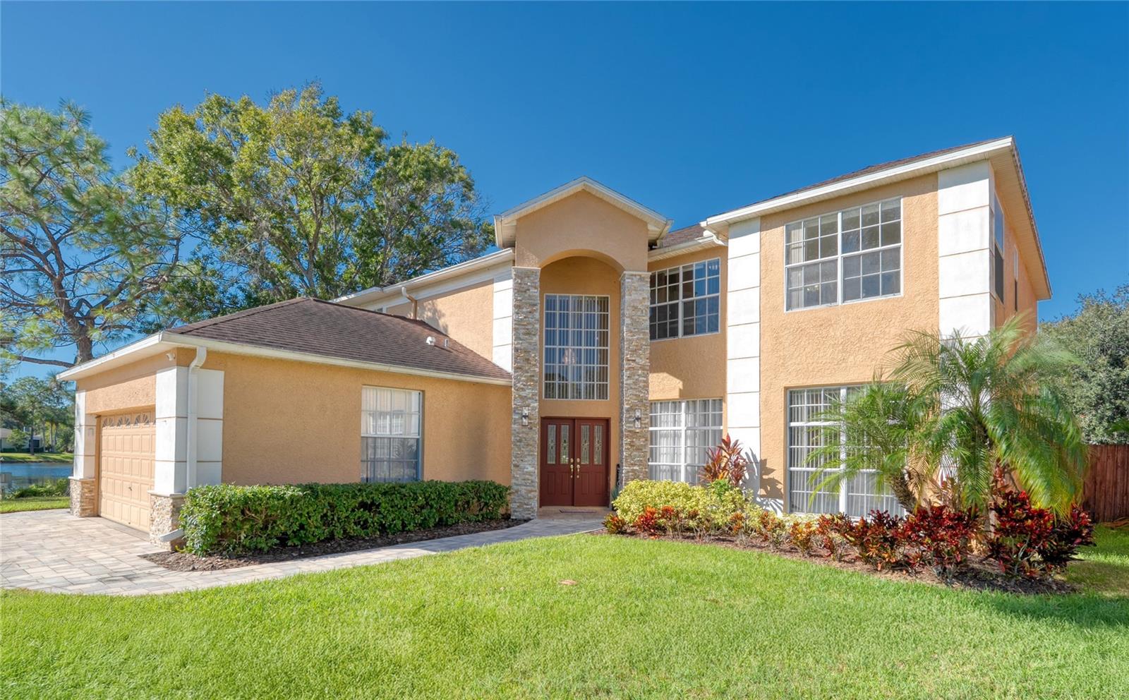 Stone accents on the stately Entry way columns and Garage add to the curb appeal of this home