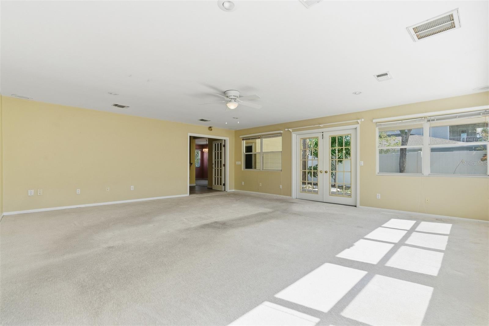 HUGE family room with french doors to decking