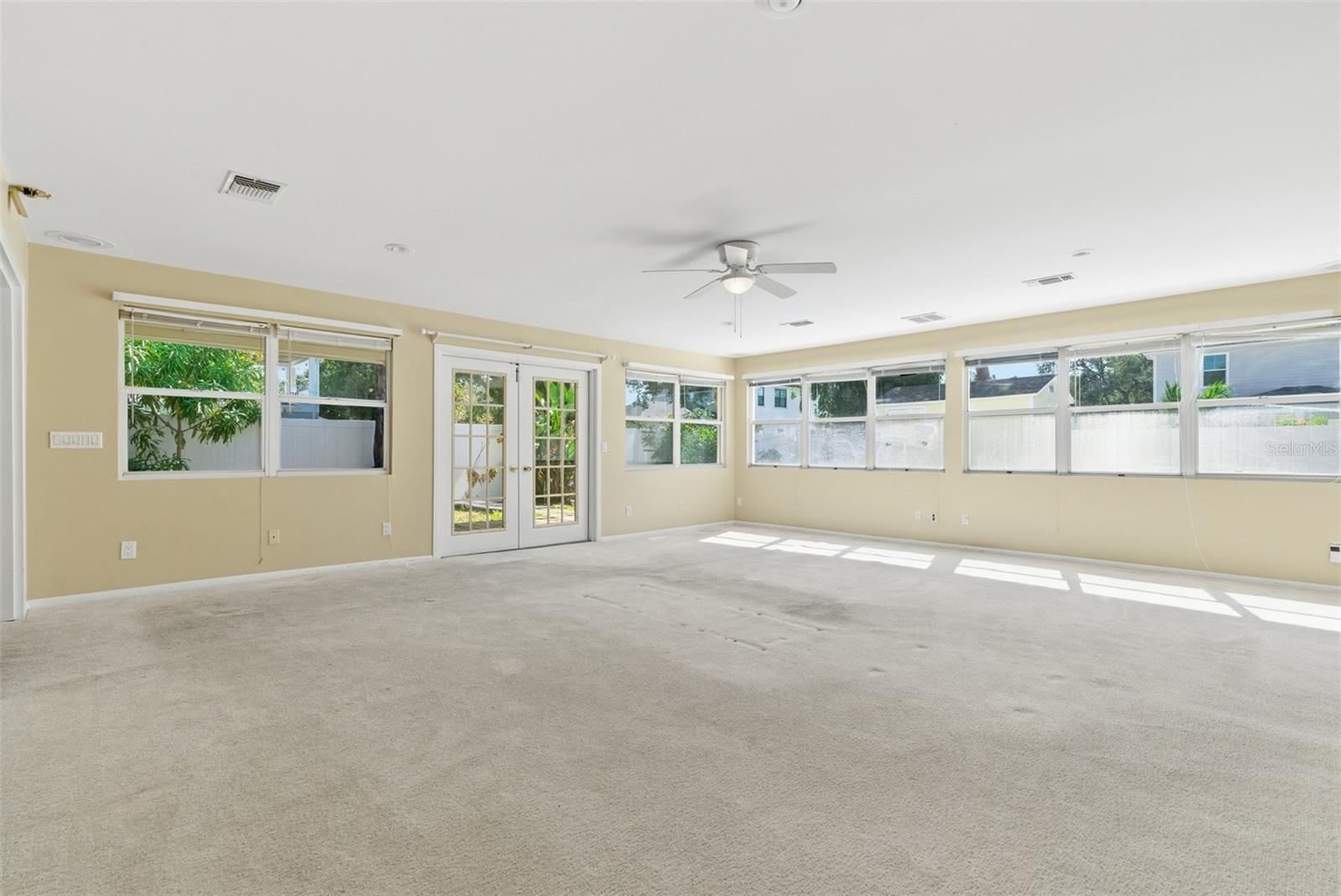 Family room overlooks deck/side yard, rear yard and POOL!