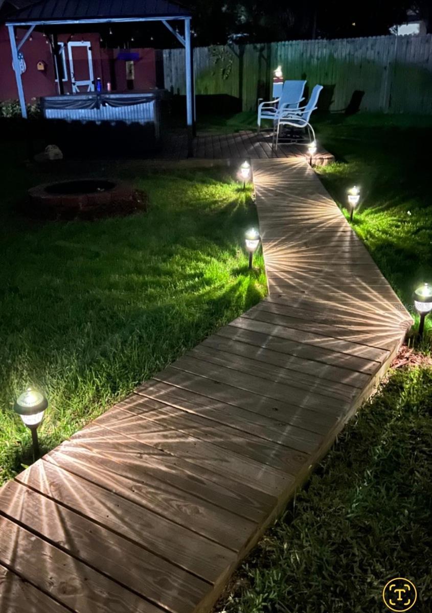 Lighted walkway that brings you to the jacuzzi