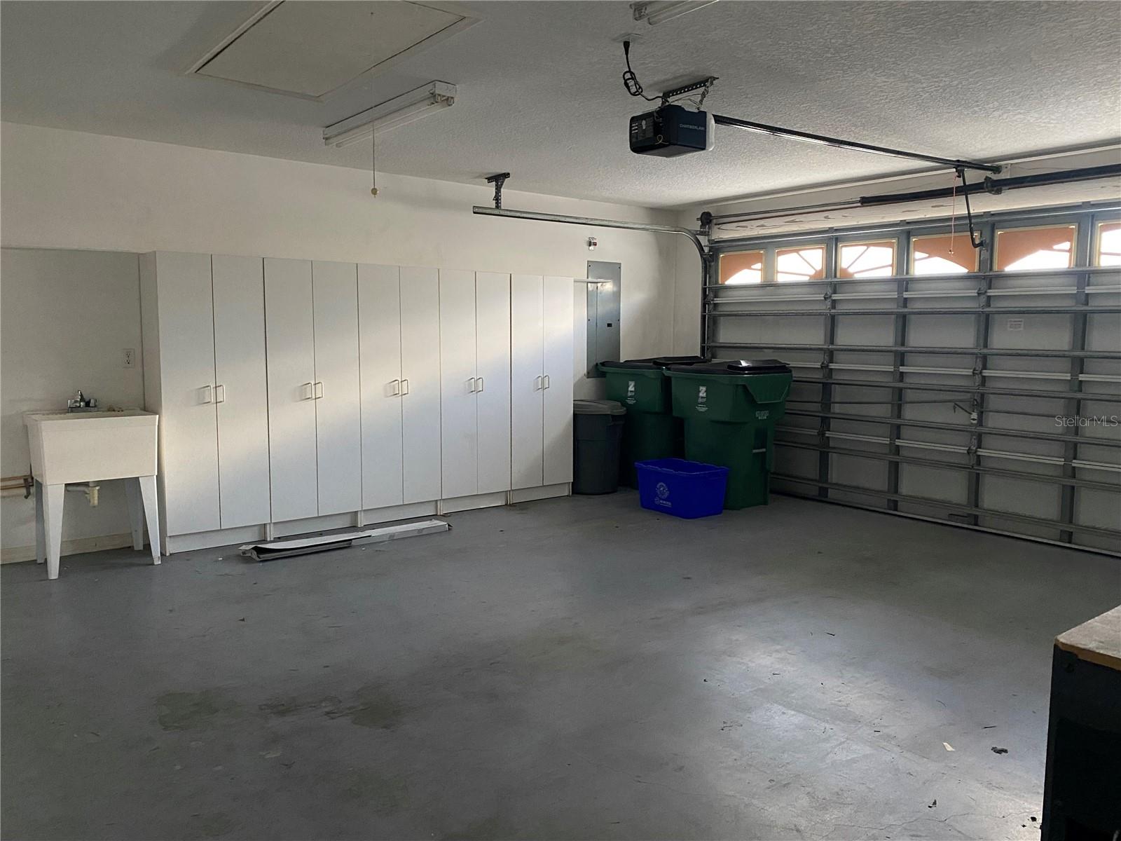 Garage with storage cabinets & wash tub
