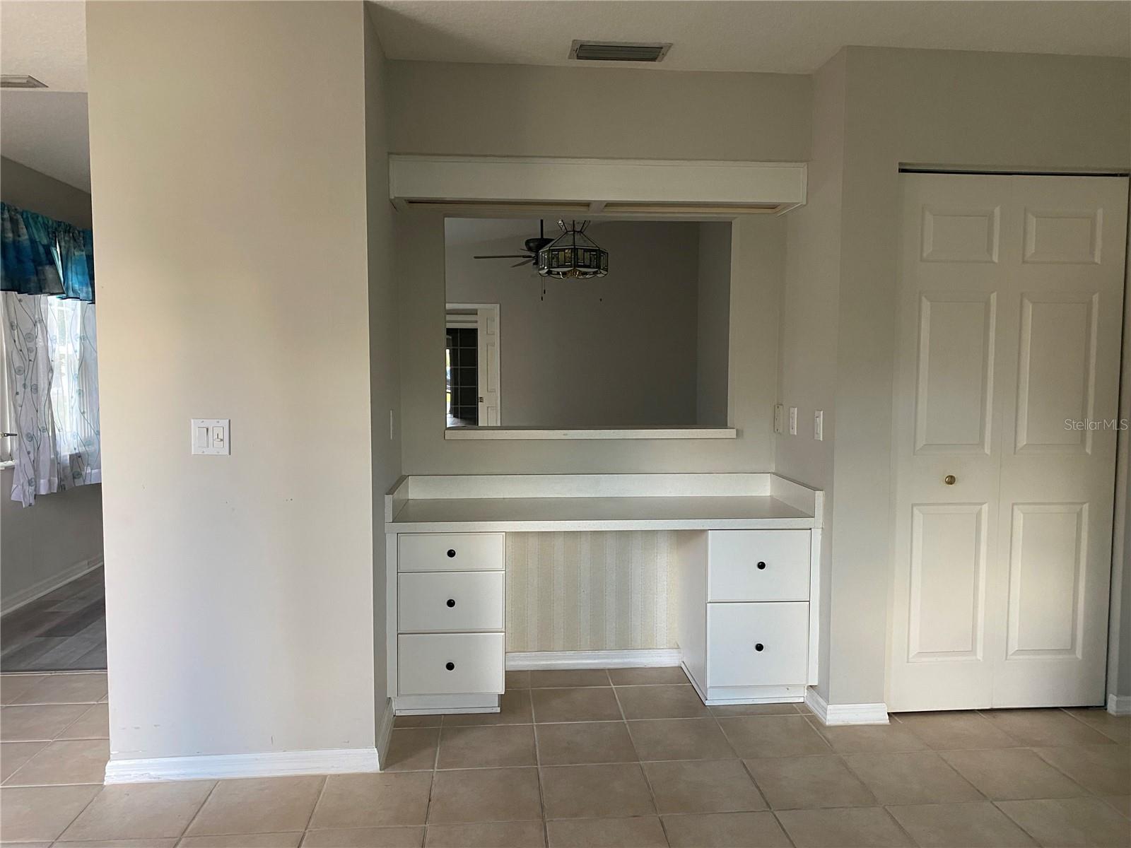 Desk area in Kitchen and Pantry to the right