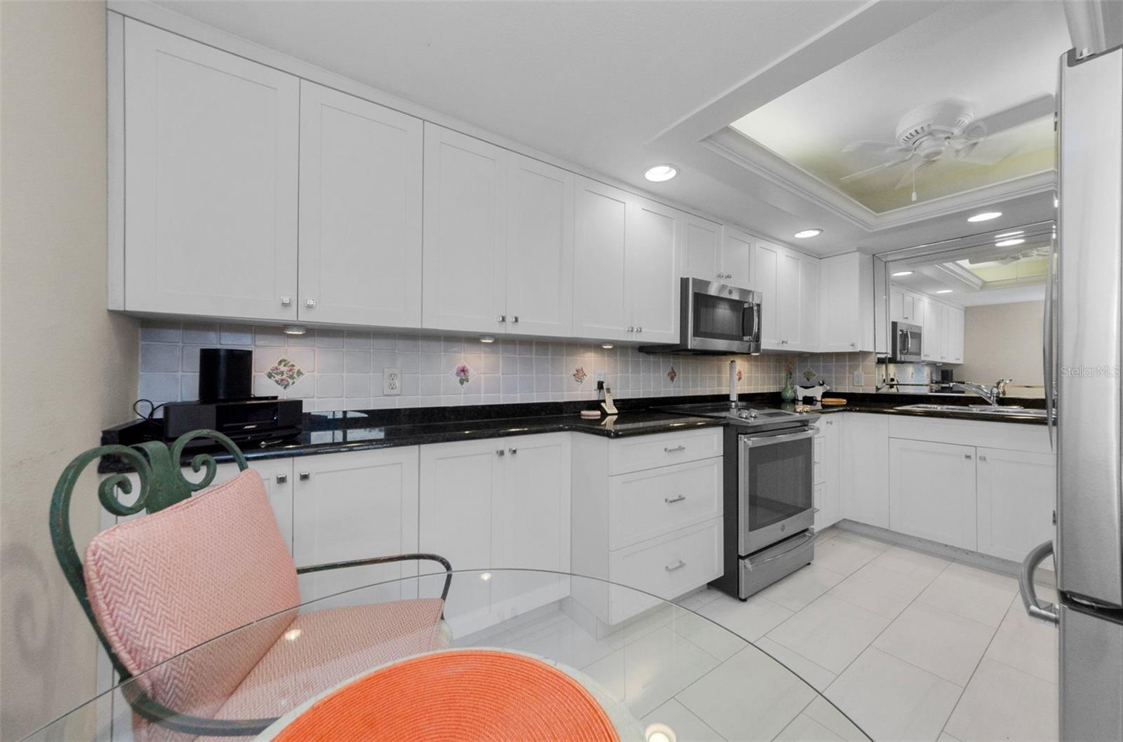 Eat in kitchen with so much storage and countertop space! Great for cookies and baking!
