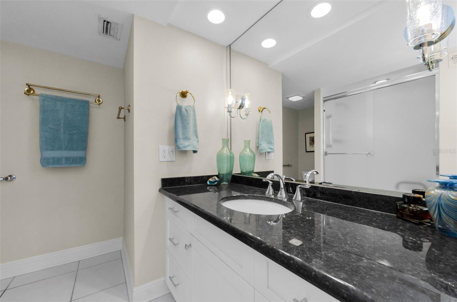 Guest bath with a walk in shower across from 2nd bedroom.