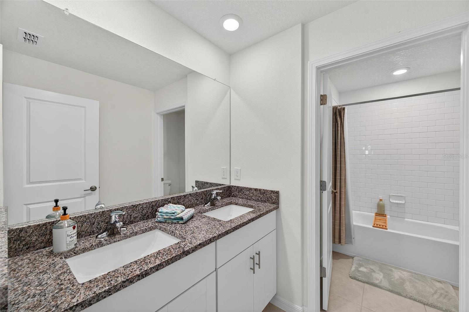 Second floor bathroom with dual sinks