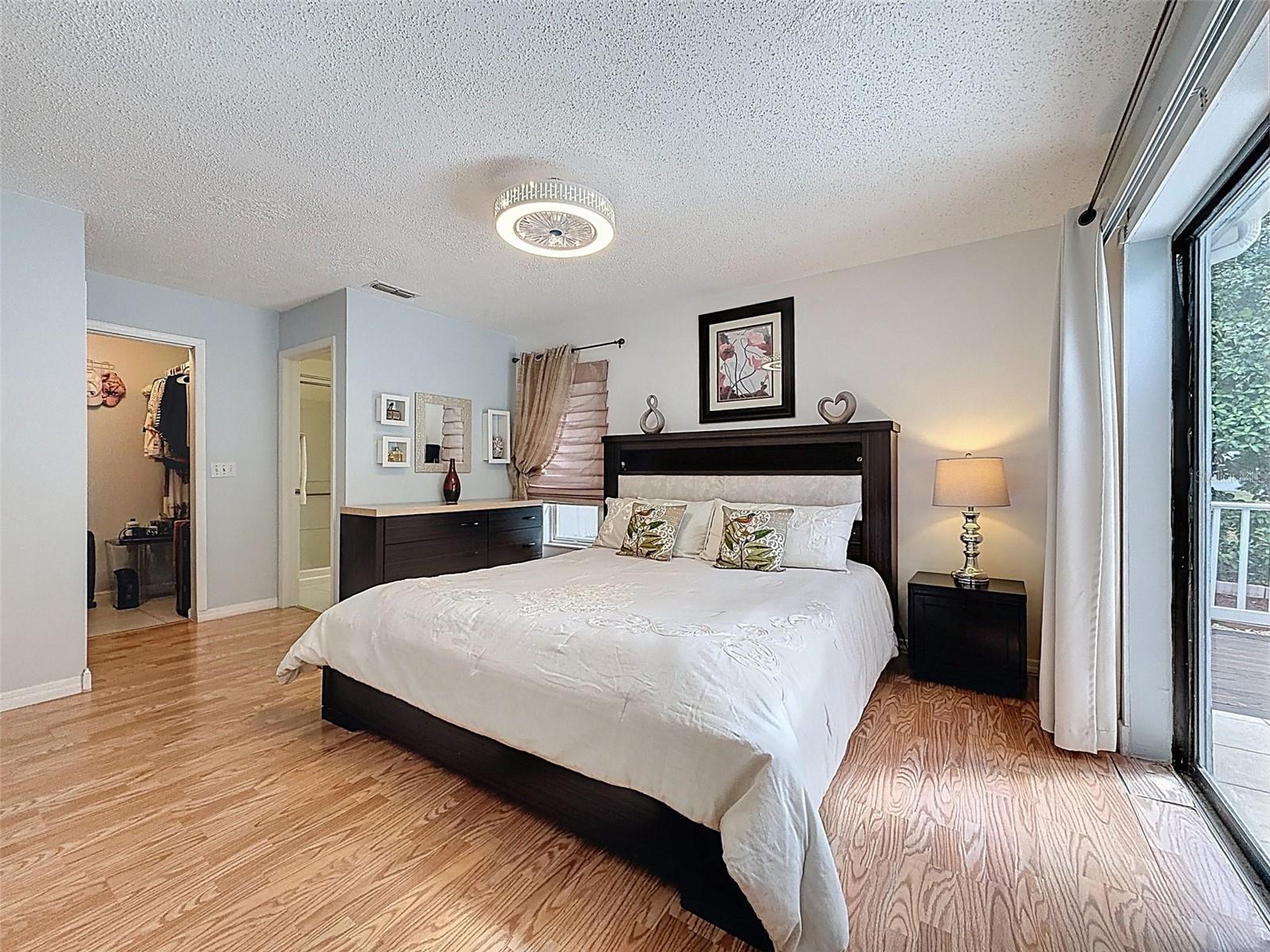 Master bedroom with slider to the lovely backyard.