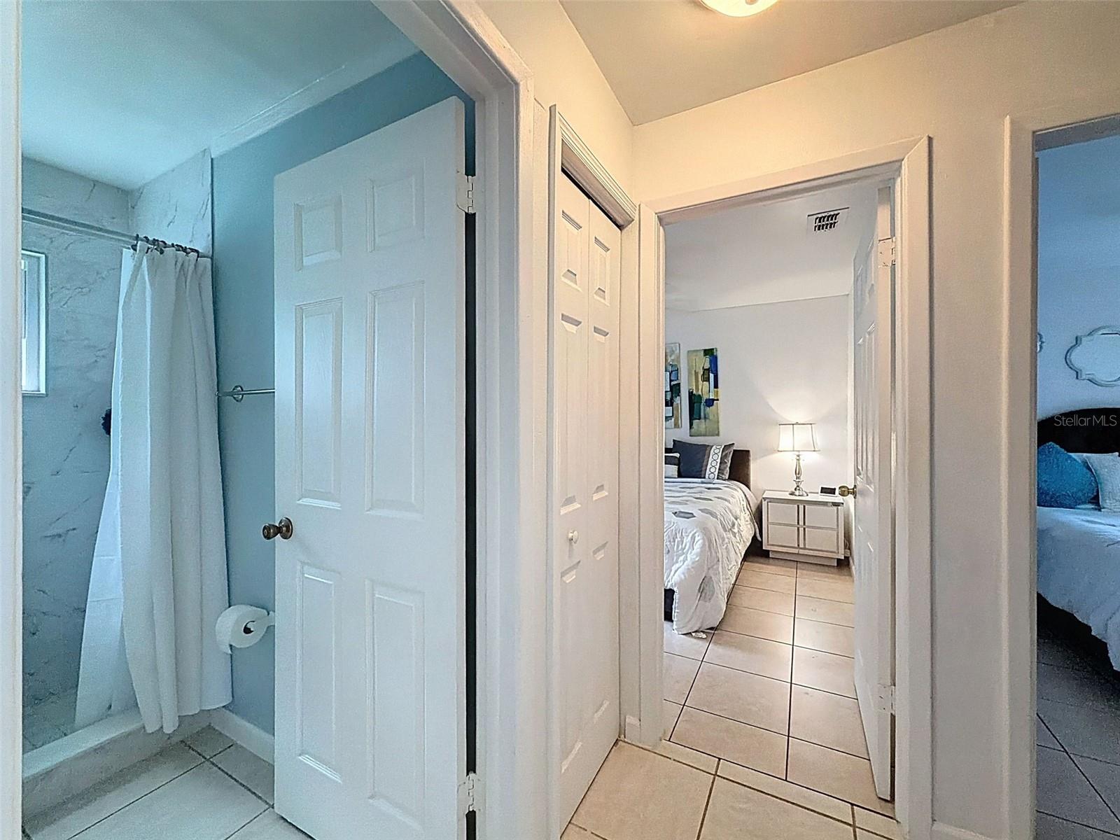 Hallway to 2nd and 3rd bedrooms with its own bathroom.