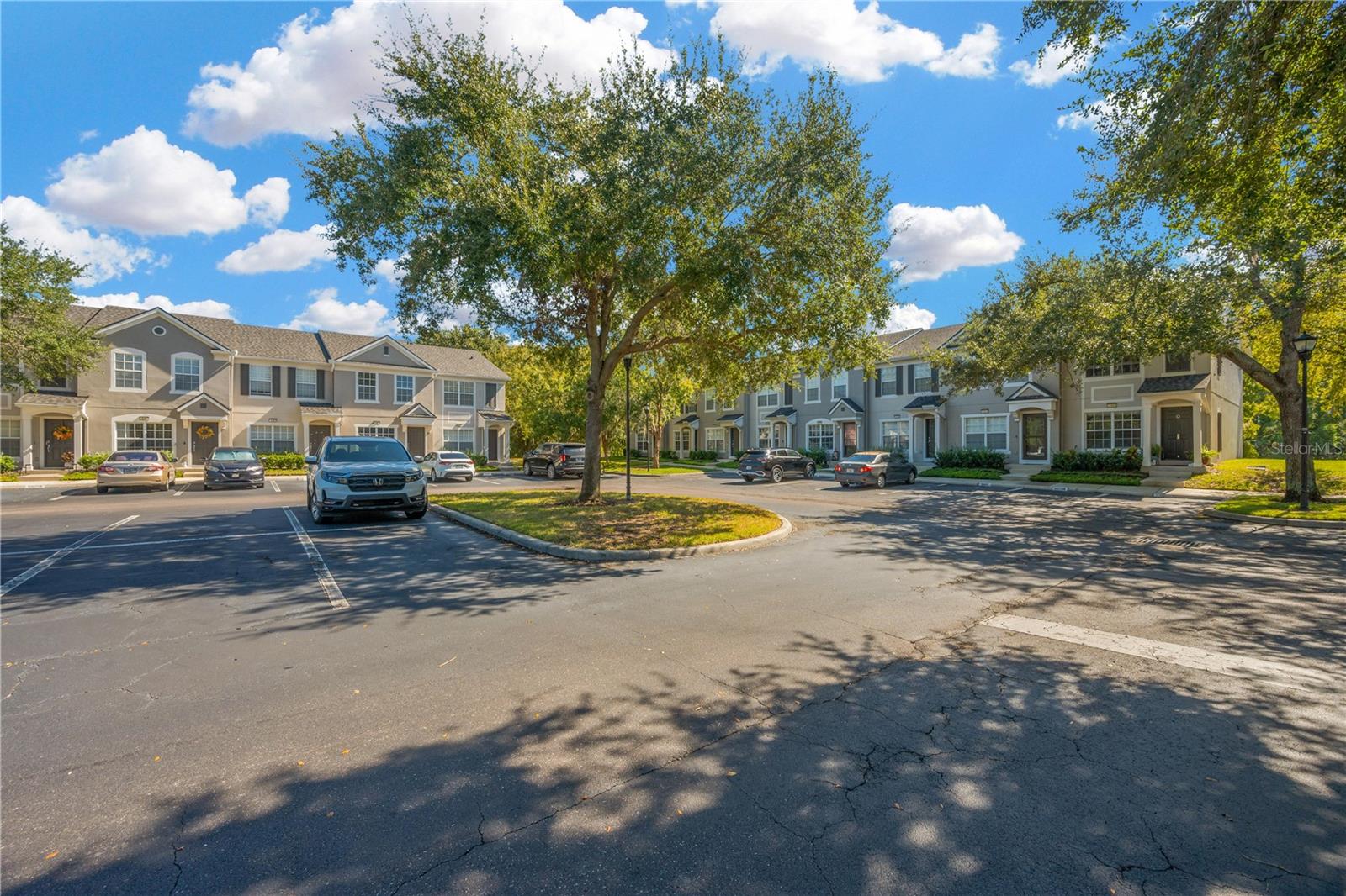 Front Parking Lot View with Ample Parking (Home is second unit furthest right)