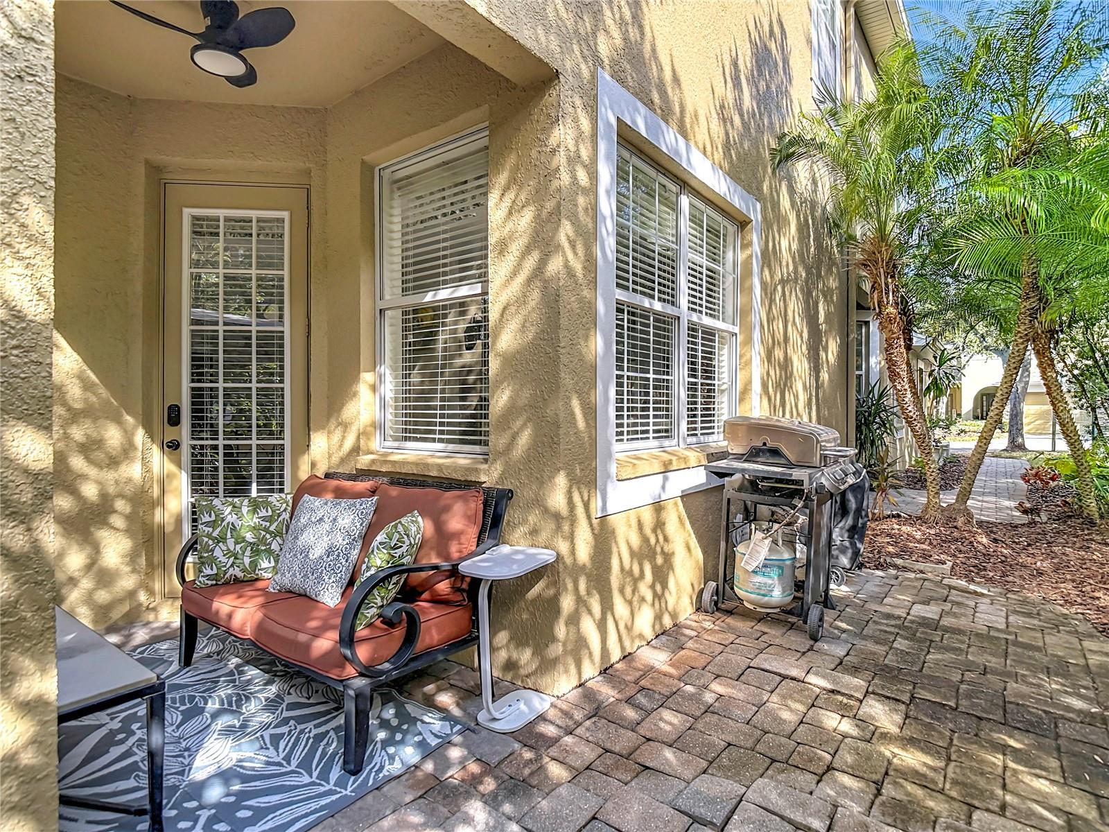 Pavered back patio with space for outdoor grilling