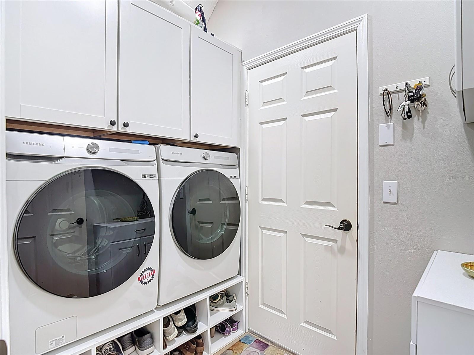 Inside utility room leading to garage
