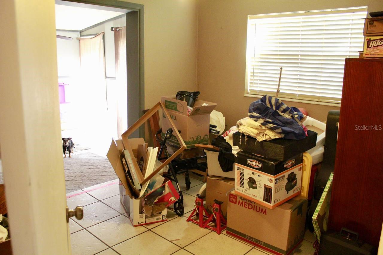 Bedroom with extra room and half bathroom