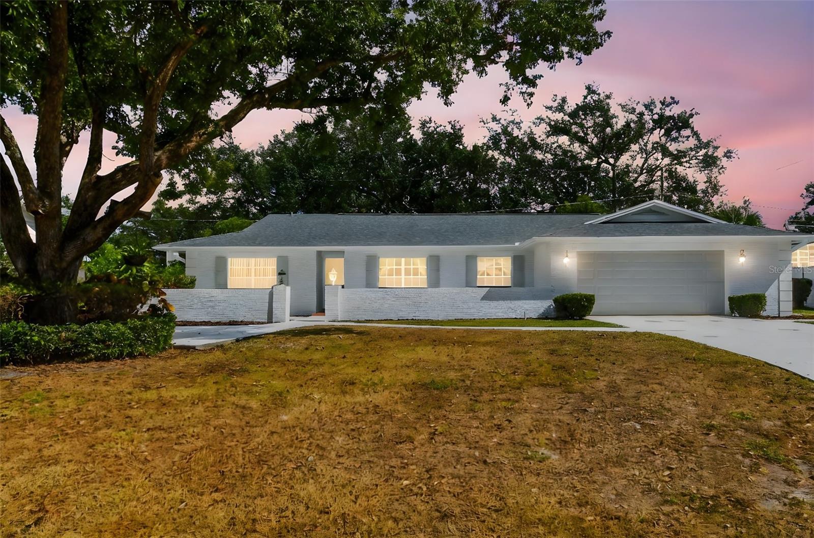 Twilight view of the front exterior of this lovely home.