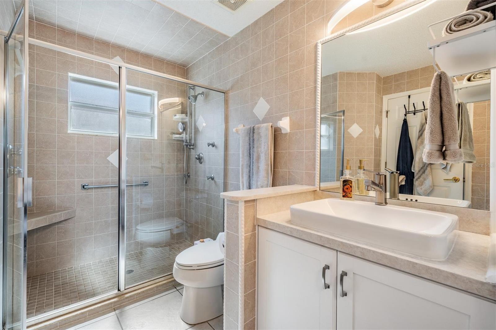 Oversized step-in shower with built-in seating