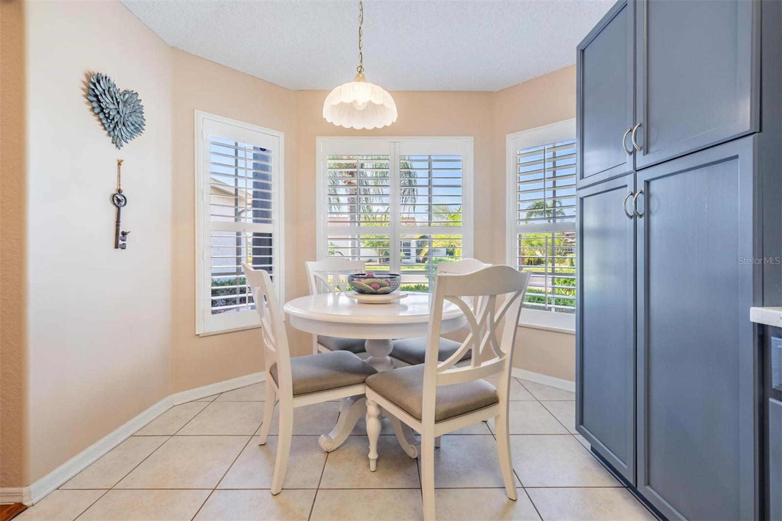 Sunny breakfast nook with additional cabinet space