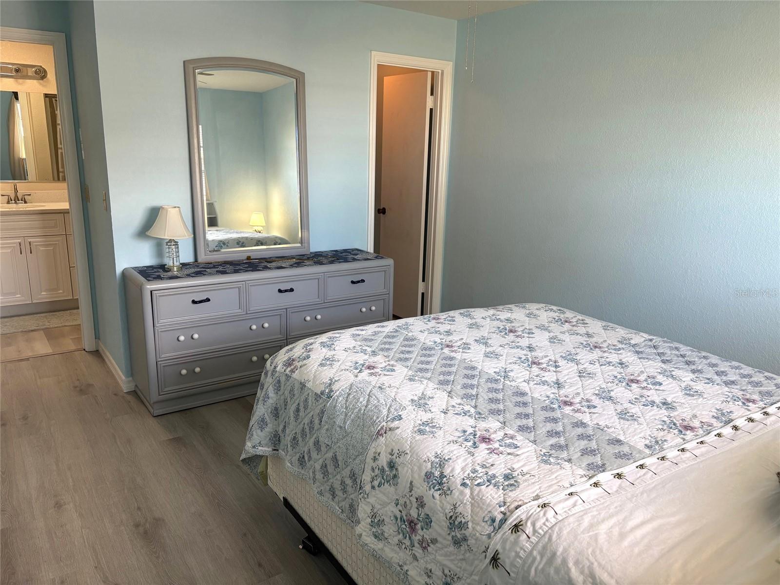Primary Bedroom showing doors to closet & Bathoom