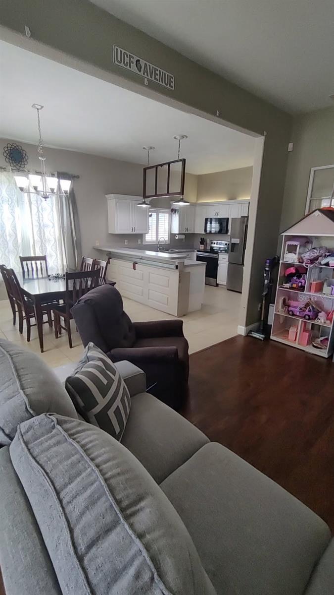 Living Room looking into kitchen and Dining Room