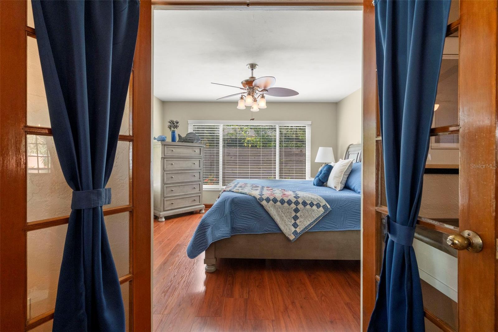 French doors bring you into the bonus room.