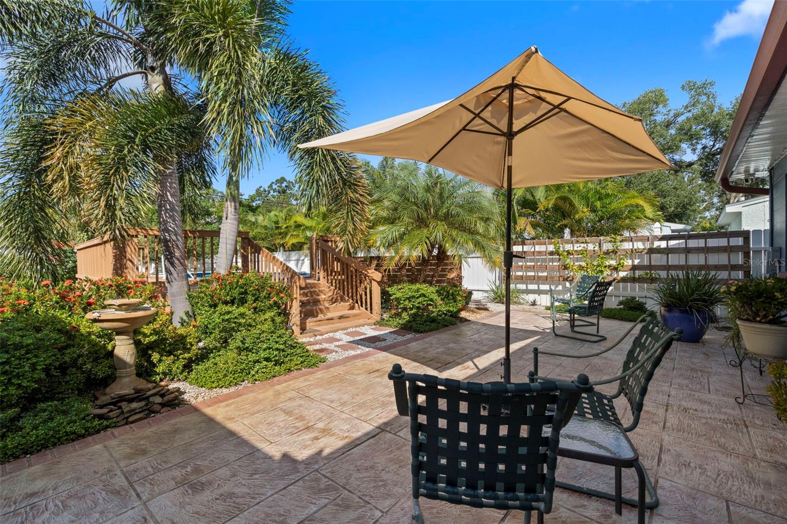 An additional paver patio ensures comfort for all guests and sunbathers.