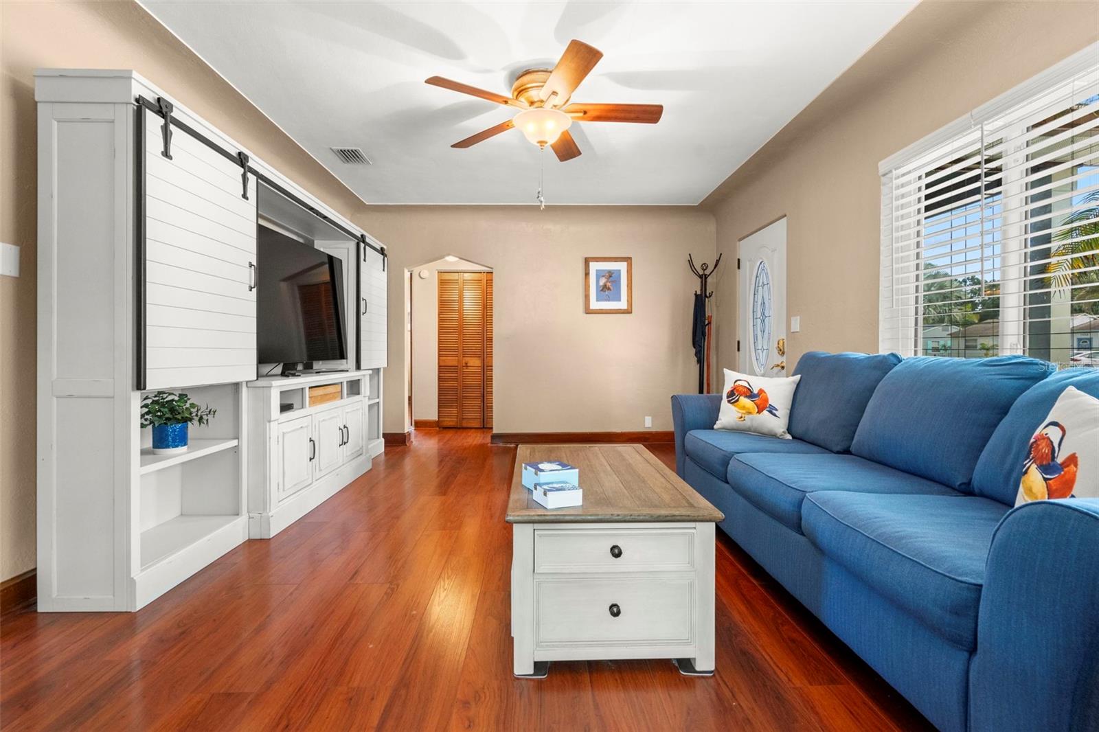 Coved ceilings, archways, honey toned wood accents, and built-ins all give a graceful nod to yesteryear.