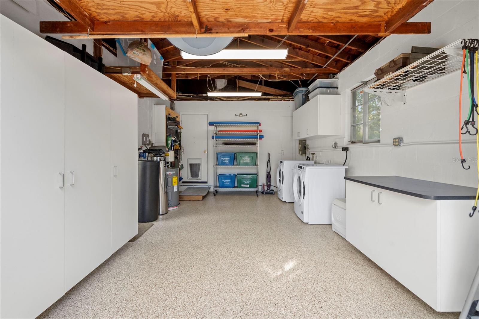 Extra storage cabinets have been recently added with an epoxy floor.