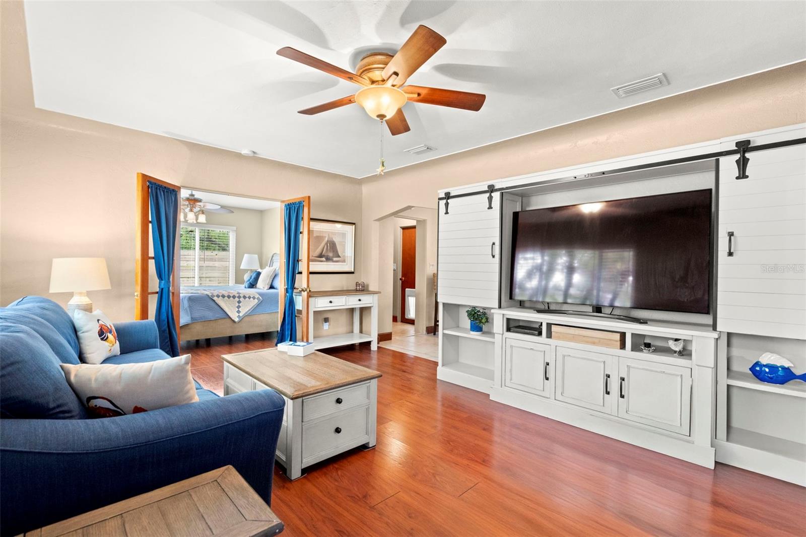 A spacious living room opens into a thoughtfully crafted kitchen.