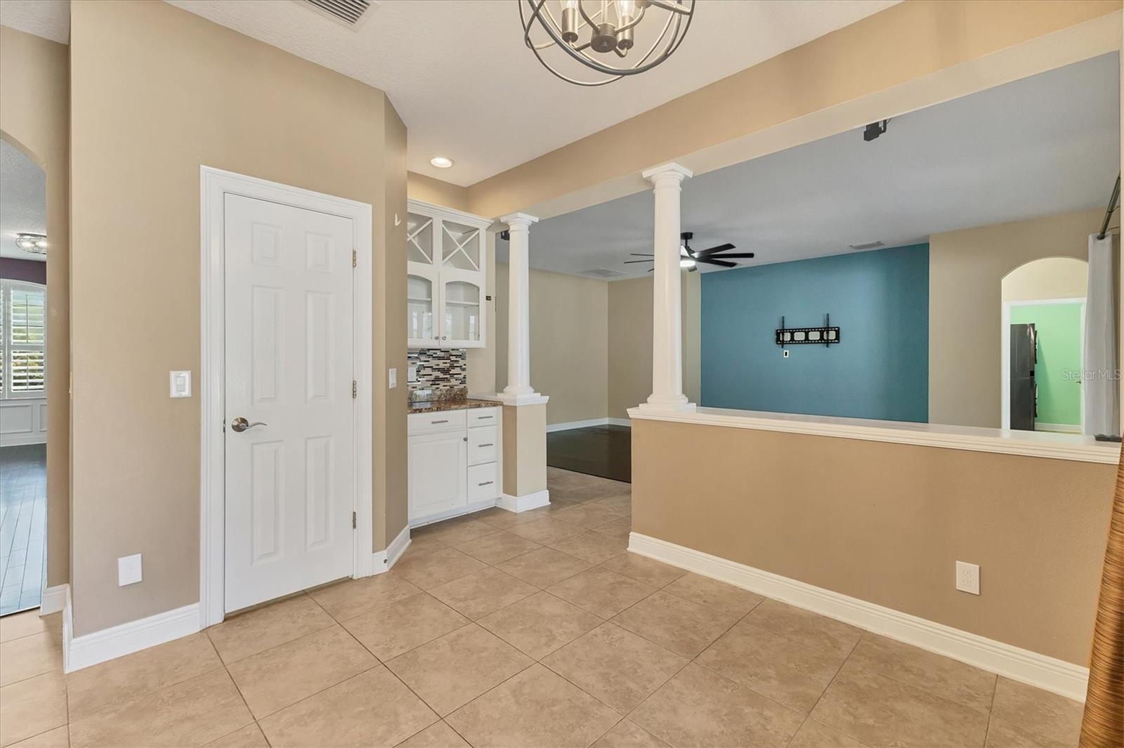 HUGE walk-in pantry behind the door.  Convenient storage & dry bar area adjacent to family room