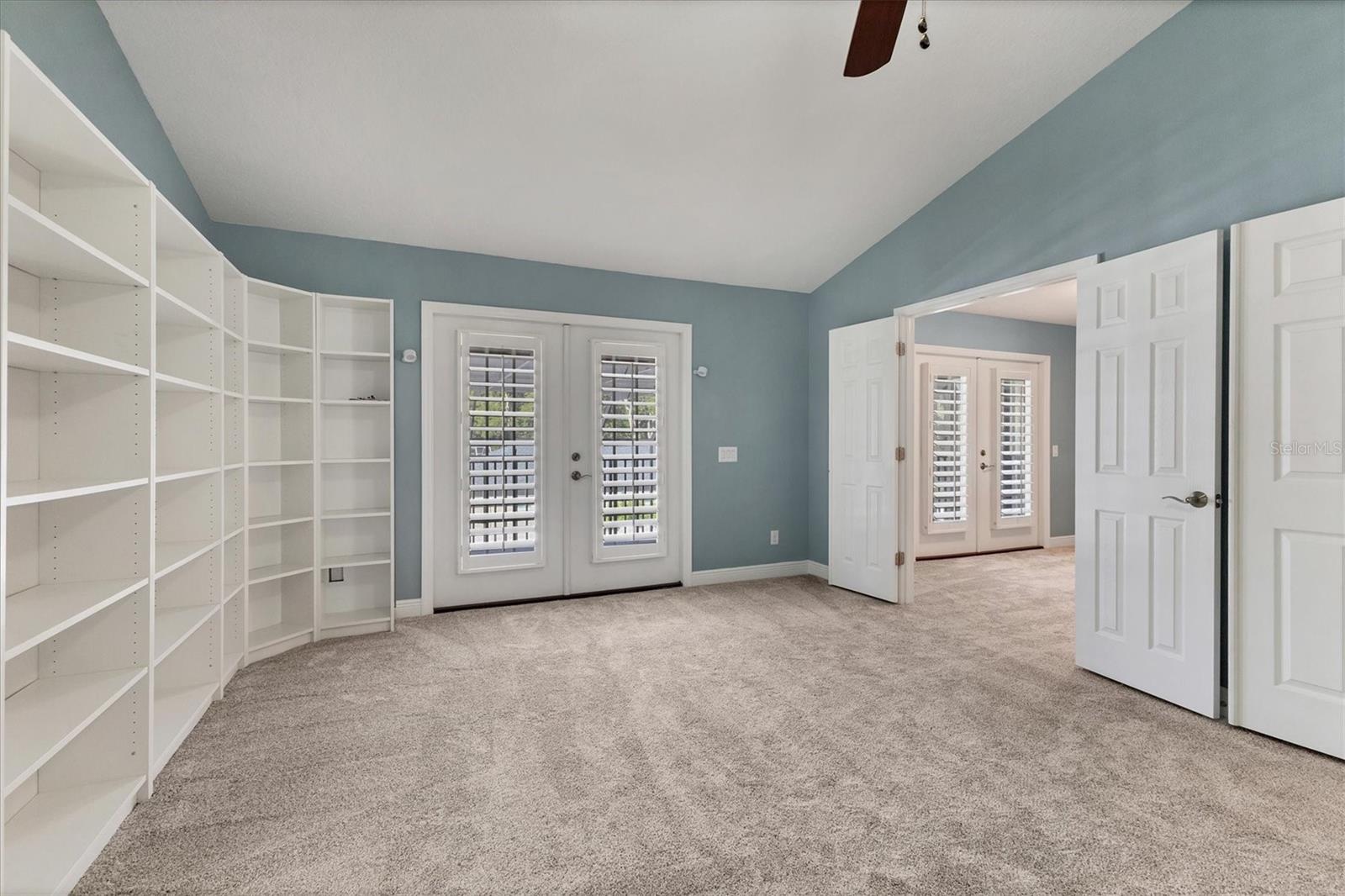 French doors lead outside to upstairs deck.  Adjoining bedroom through double doors would make an ideal nursery, office, etc.
