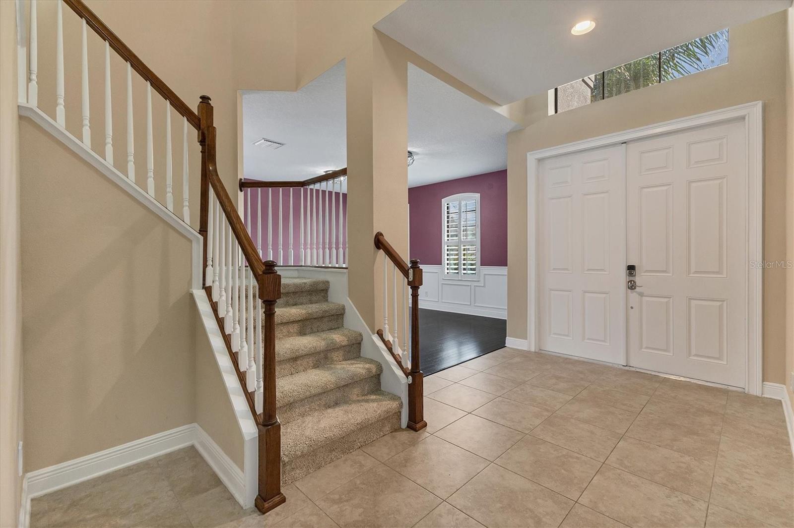 Entrance into the spacious open foyer. Formal living areas to the right of front entry