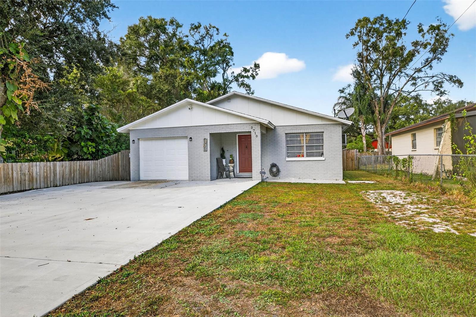 Front view of home and spacious driveway