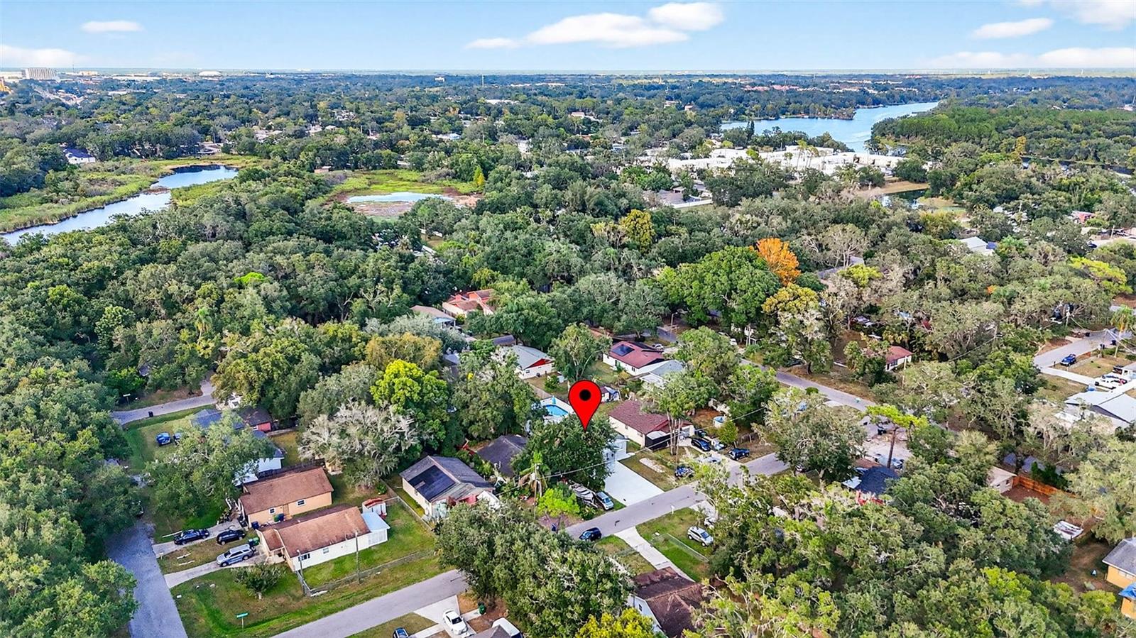 Aerial view of home & surrounding neighborhood