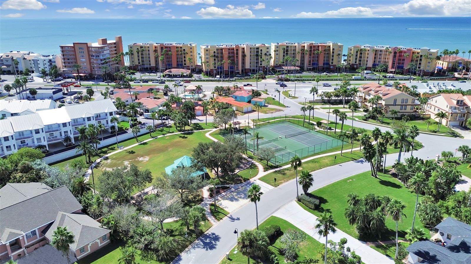 Steps to community park, with tennis, pickleball courts, gazebo, play area and walking path