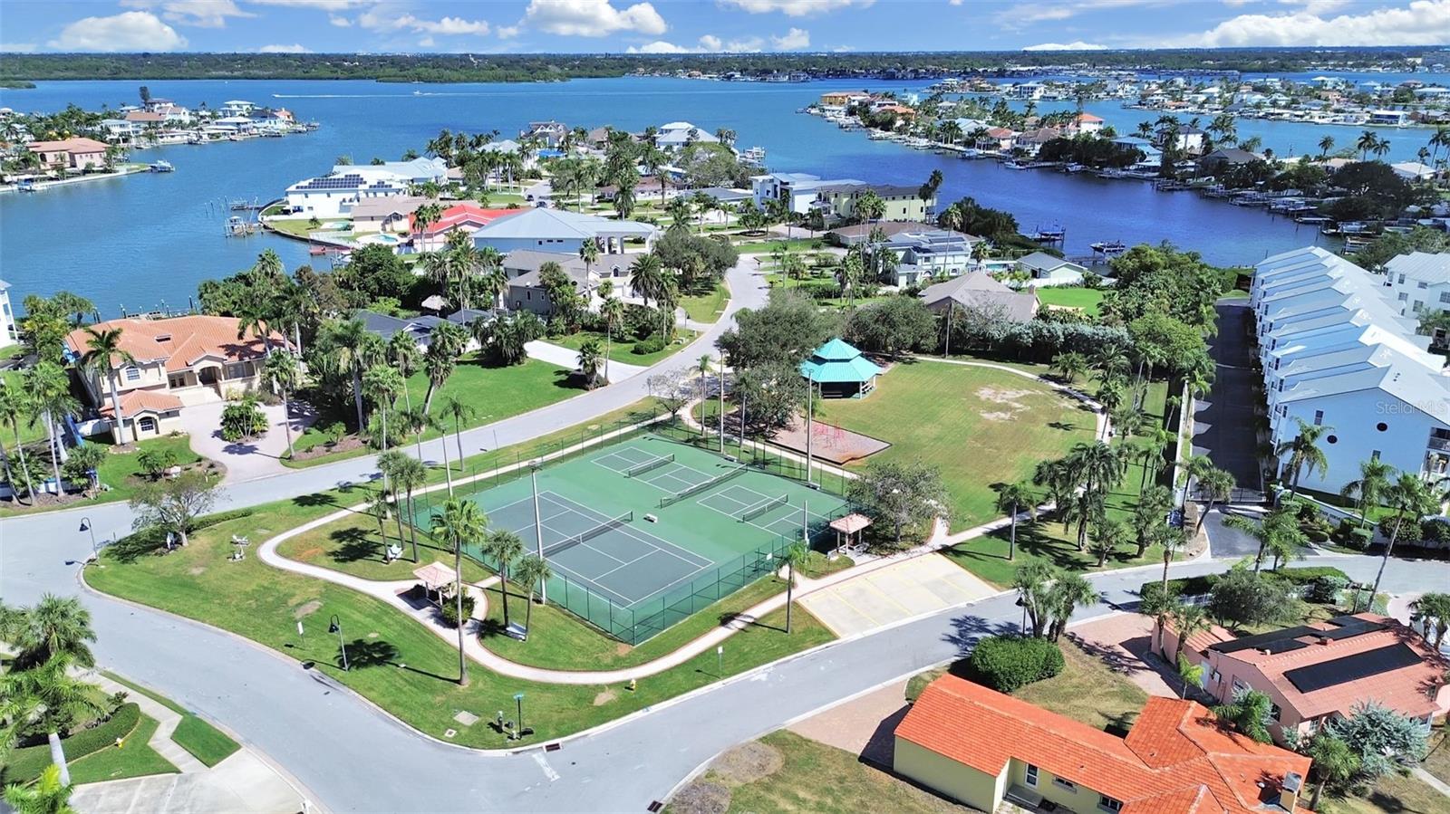 Tennis and pickleball courts, gazebo and playground just steps away