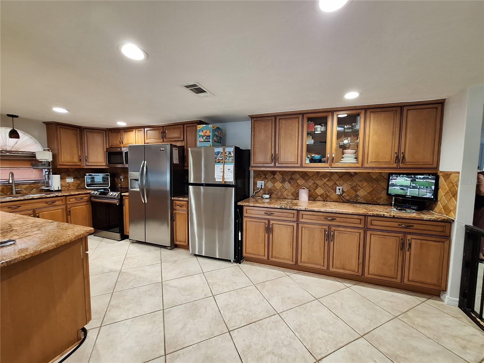 A Kitchen to die for on each side of the residence